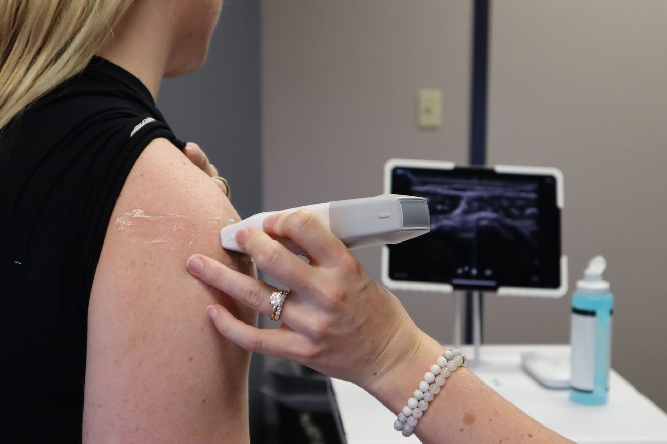 Shoulder ultrasound being performed on a patient